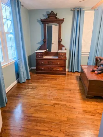 a view of fireplace and wooden floor