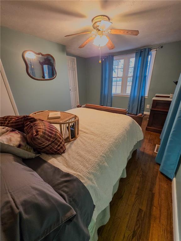 589 Jacksonville Scotland Road Jacksonville, GA 31544 - Photo 33 of 87 a bedroom with a bed and a chandelier