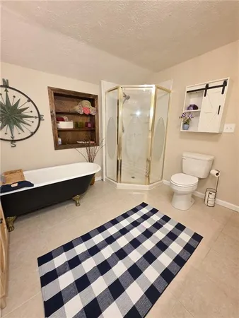 a view of a room with wooden floor and closet