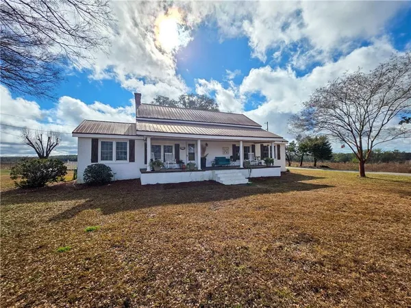 a living room with couch and a fireplace