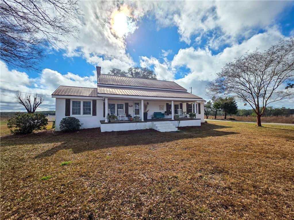 589 Jacksonville Scotland Road Jacksonville, GA 31544 - Photo 4 of 87 a view of a house with a yard