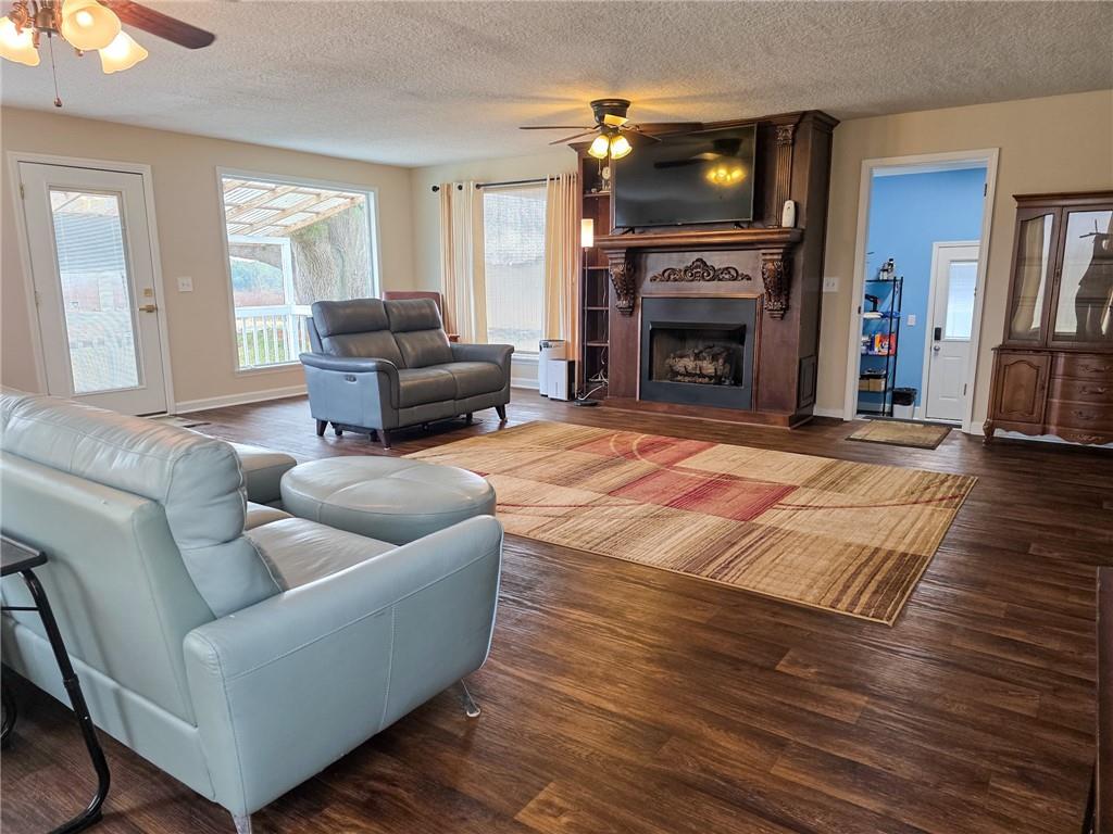 589 Jacksonville Scotland Road Jacksonville, GA 31544 - Photo 46 of 87 a living room with furniture and a fireplace