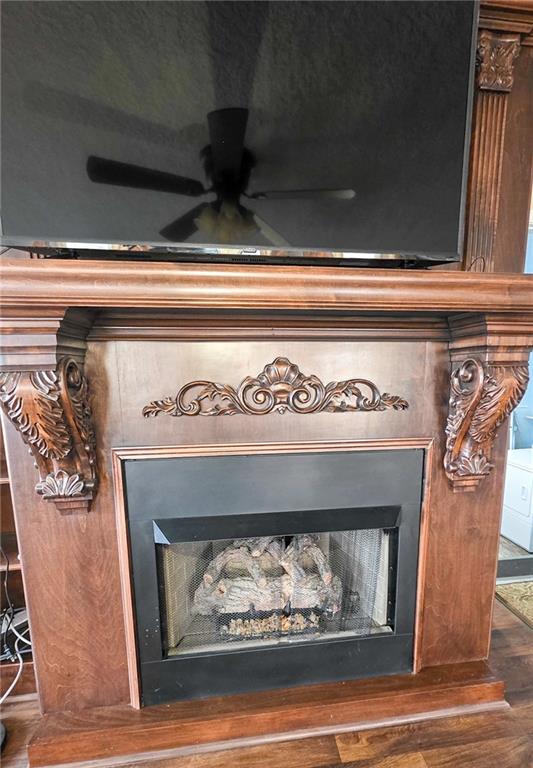 589 Jacksonville Scotland Road Jacksonville, GA 31544 - Photo 52 of 87 a view of fireplace and wooden floor