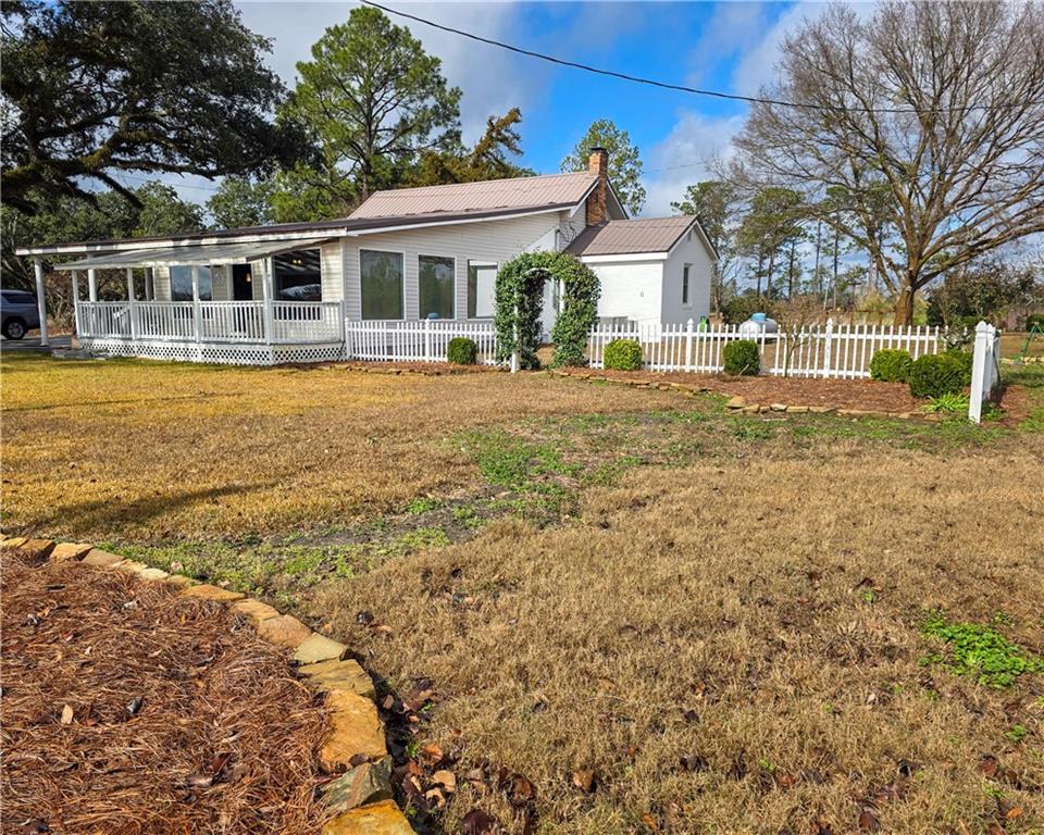 589 Jacksonville Scotland Road Jacksonville, GA 31544 - Photo 63 of 87 a front view of a house with a yard