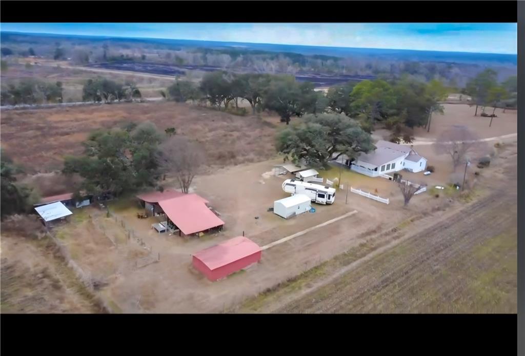 589 Jacksonville Scotland Road Jacksonville, GA 31544 - Photo 87 of 87 a view of a room with a table and couches chair