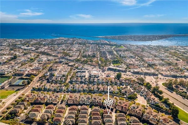 an aerial view of residential building and ocean