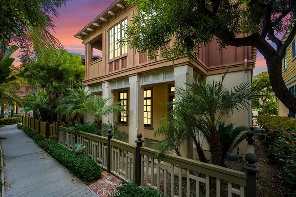 a view of a house with a tree in a yard