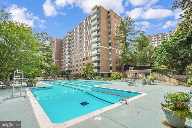 a outdoor view with a building and trees in the background