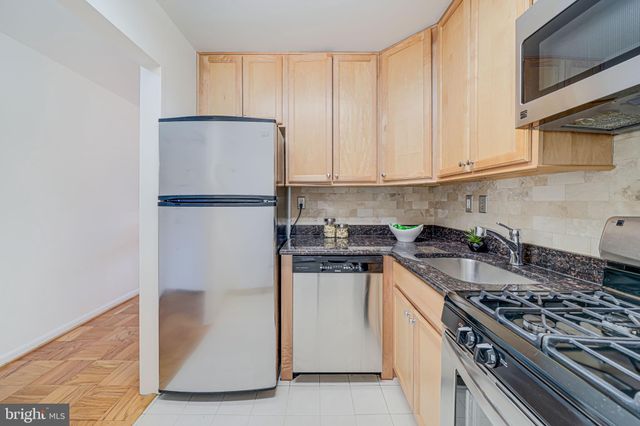 a kitchen with a stove and a refrigerator