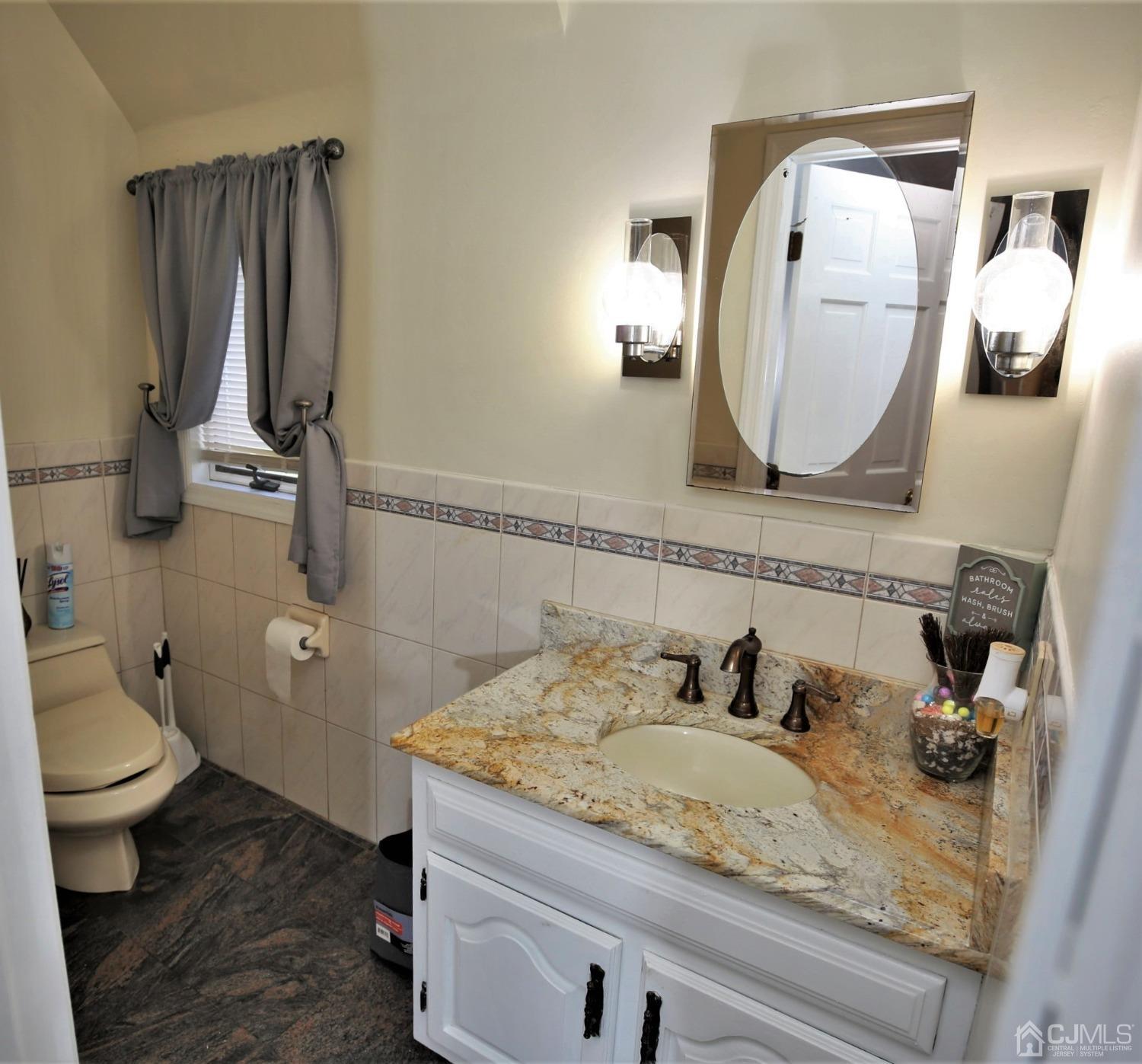 55 Friendship Road Cranbury, NJ 08512 - Photo 28 of 71 a bathroom with a granite countertop sink mirror and toilet