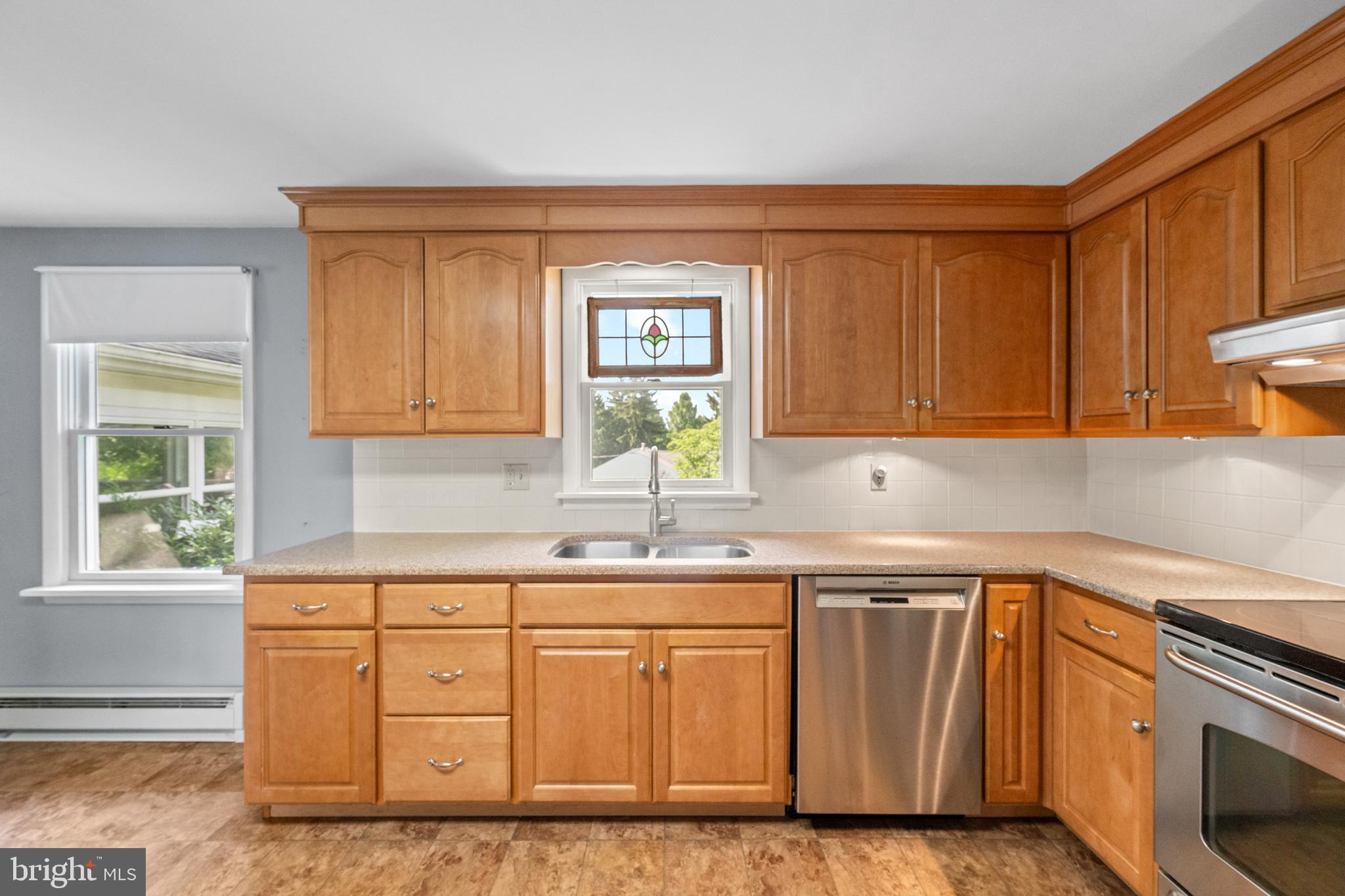 258 Monacy Road Coatesville, PA 19320 - Photo 19 of 54 a kitchen with granite countertop cabinets stainless steel appliances a sink and a window