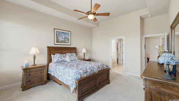 a bedroom with a bed and a table