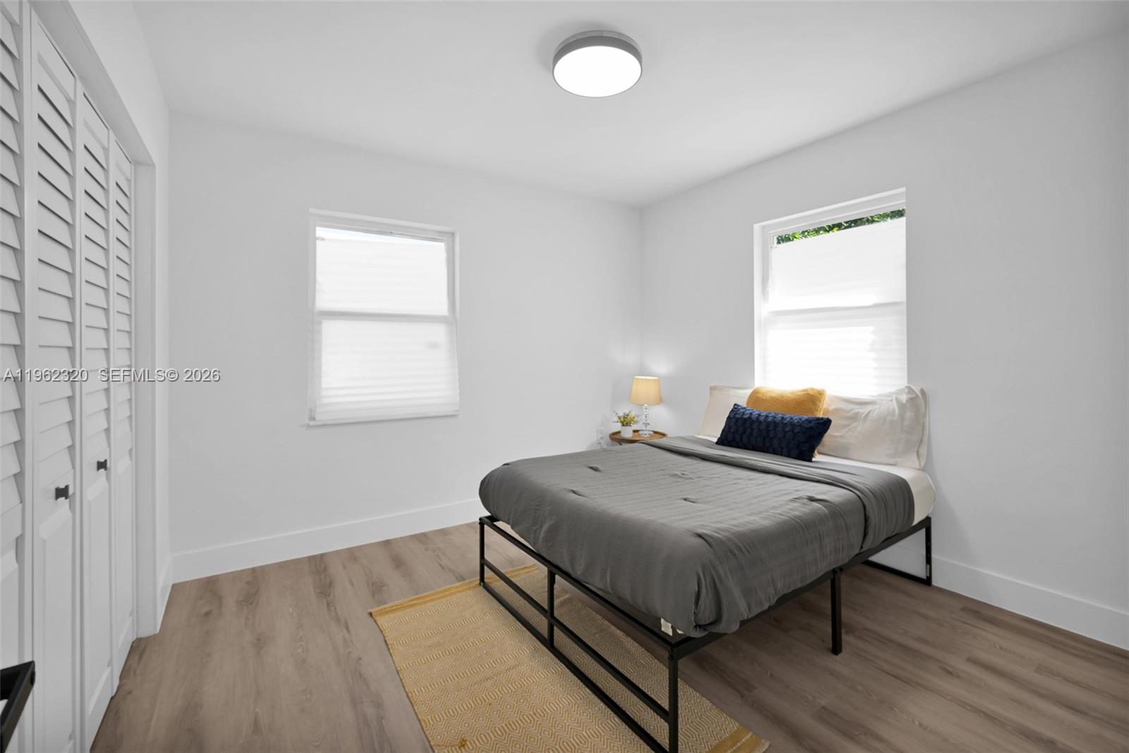 6540 Southwest 4th Street, Unit 6540 Miami, FL 33144 - Photo 13 of 42 a bedroom with a bed and window