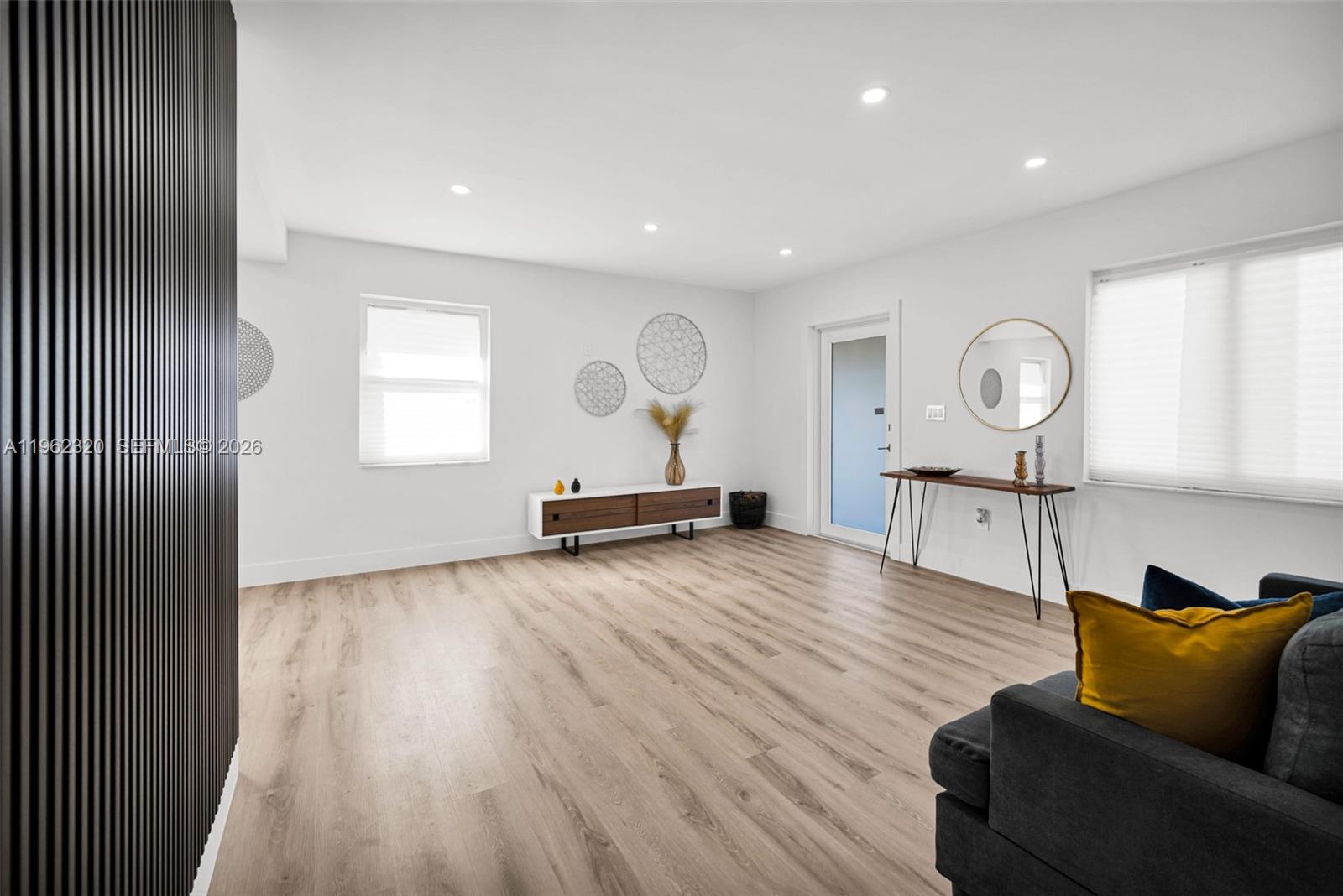 6540 Southwest 4th Street, Unit 6540 Miami, FL 33144 - Photo 15 of 42 a living room with furniture and wooden floor