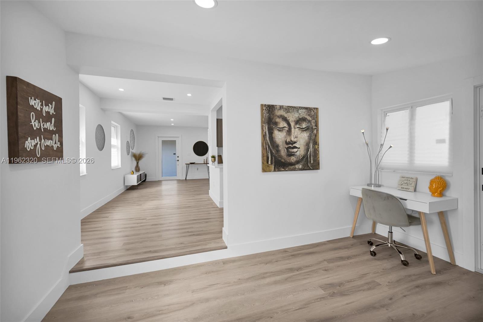 6540 Southwest 4th Street, Unit 6540 Miami, FL 33144 - Photo 24 of 42 a view of a hallway with wooden floor and furniture