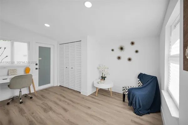 a living room with furniture and a window