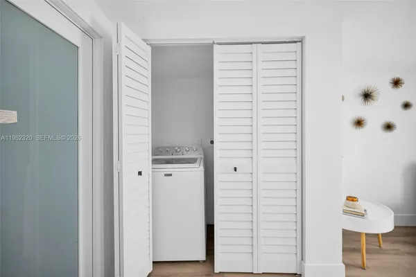 a view of a bedroom with cabinet