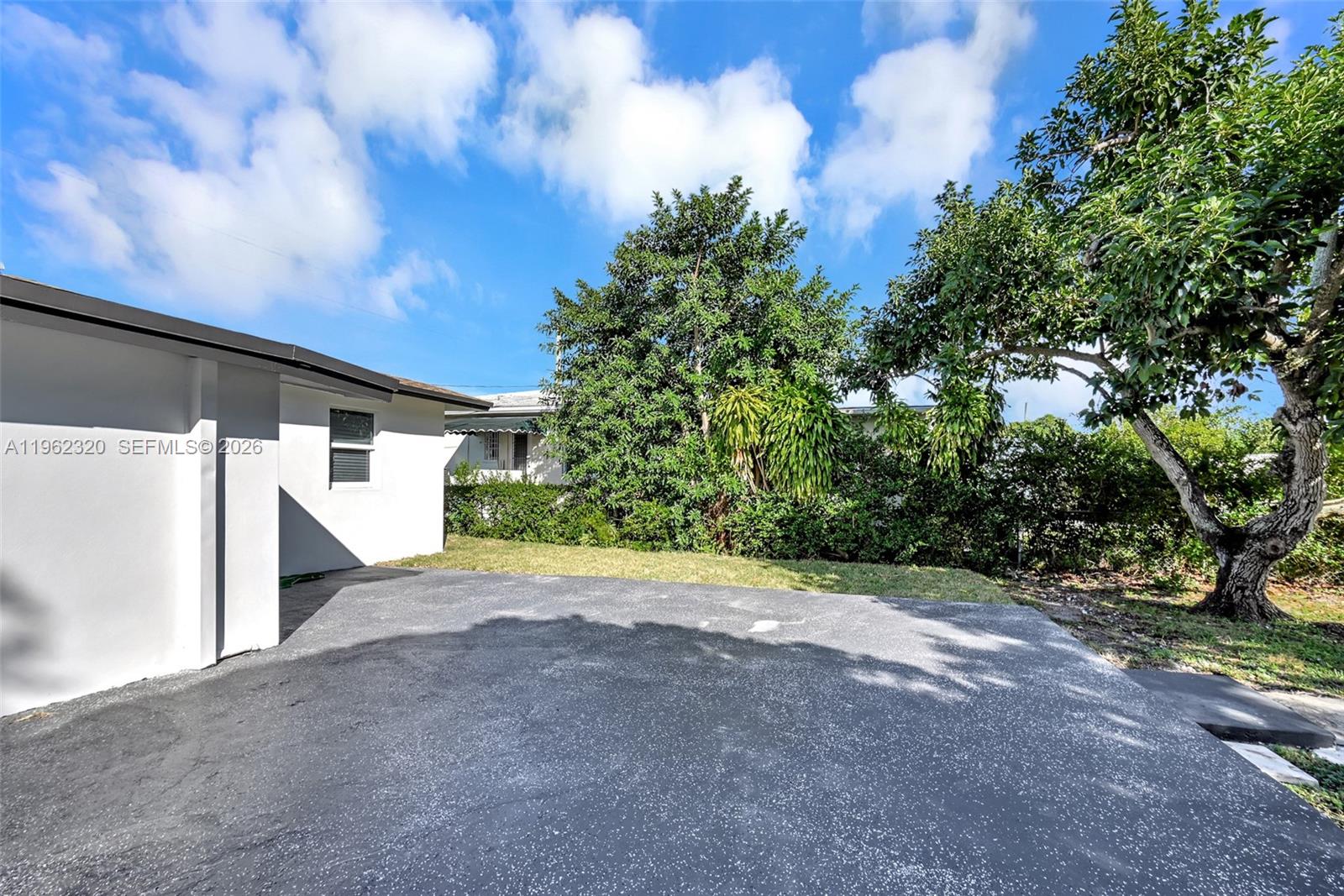 6540 Southwest 4th Street, Unit 6540 Miami, FL 33144 - Photo 31 of 42 a view of a house with a tree
