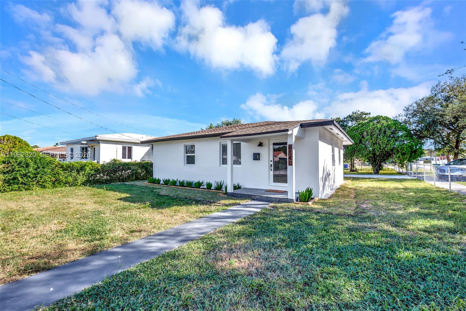 6540 Southwest 4th Street, Unit 6540 Miami, FL 33144 - Photo 35 of 42 a view of house with backyard and garden