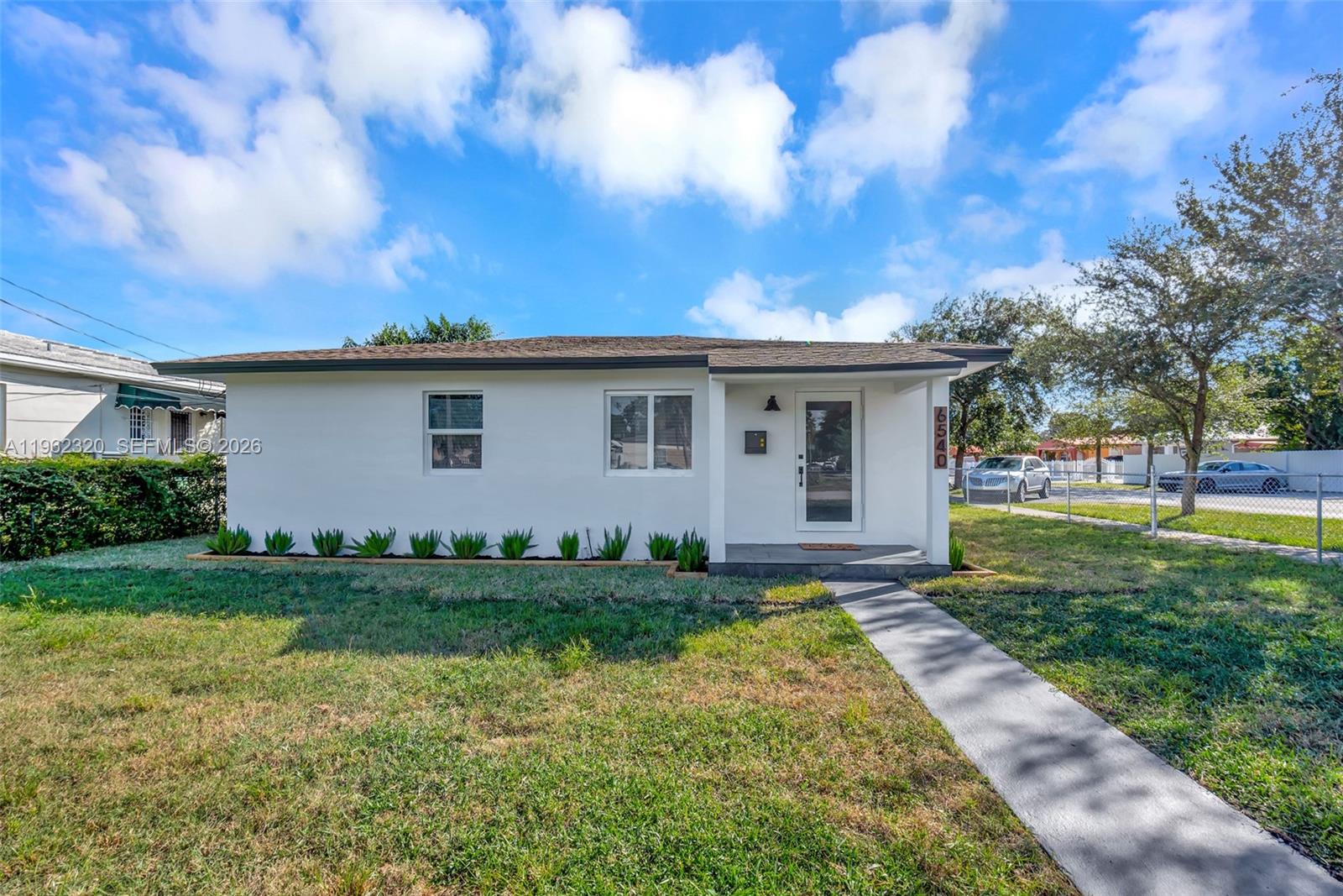 6540 Southwest 4th Street, Unit 6540 Miami, FL 33144 - Photo 5 of 42 a view of a house with backyard and garden