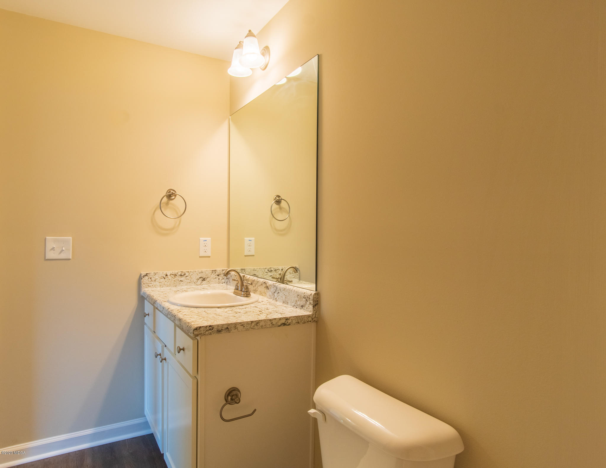 301 Pond View Road Macon, GA 31206 - Photo 15 of 20 a bathroom with a sink a toilet and mirror
