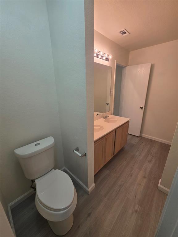 1750 Oneal Street Lancaster, TX 75134 - Photo 12 of 14 a spacious bathroom with a toilet sink and a mirror