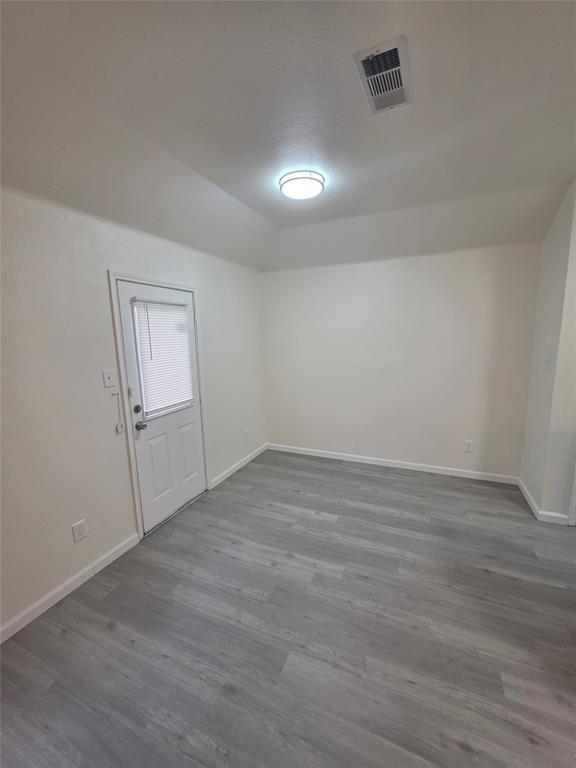 1750 Oneal Street Lancaster, TX 75134 - Photo 5 of 14 wooden floor in an empty room with a window