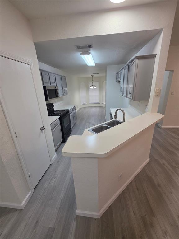 1750 Oneal Street Lancaster, TX 75134 - Photo 7 of 14 a room with wooden floors and sink