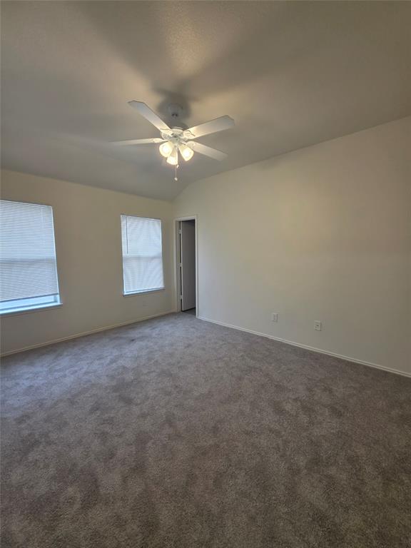 1750 Oneal Street Lancaster, TX 75134 - Photo 8 of 14 an empty room with windows and fan