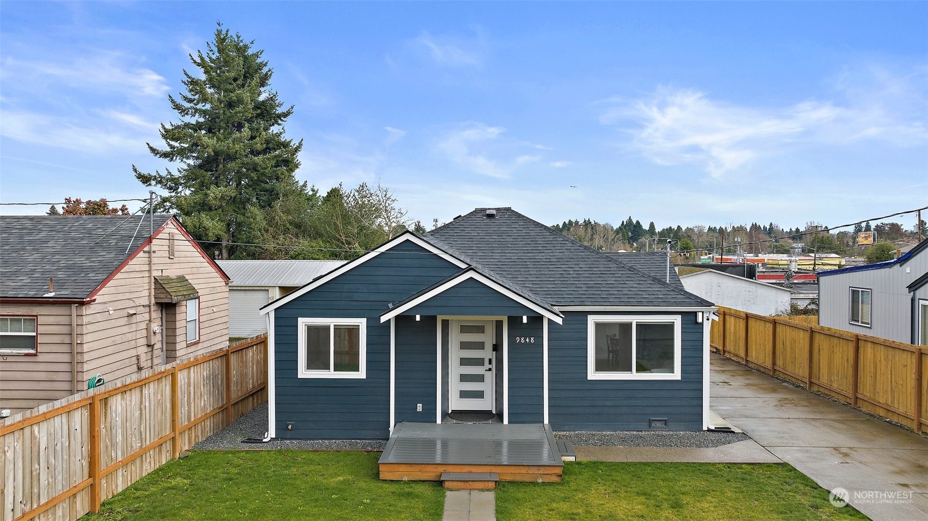 9848 18th Avenue Southwest Seattle, WA 98106 - Photo 1 of 32 a front view of a house with a yard