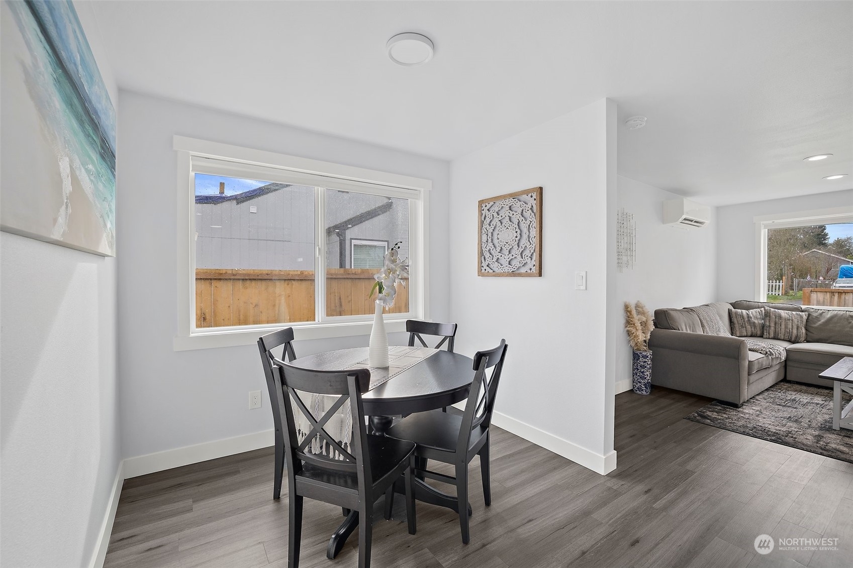 9848 18th Avenue Southwest Seattle, WA 98106 - Photo 14 of 32 a view of a dining room with furniture window and wooden floor