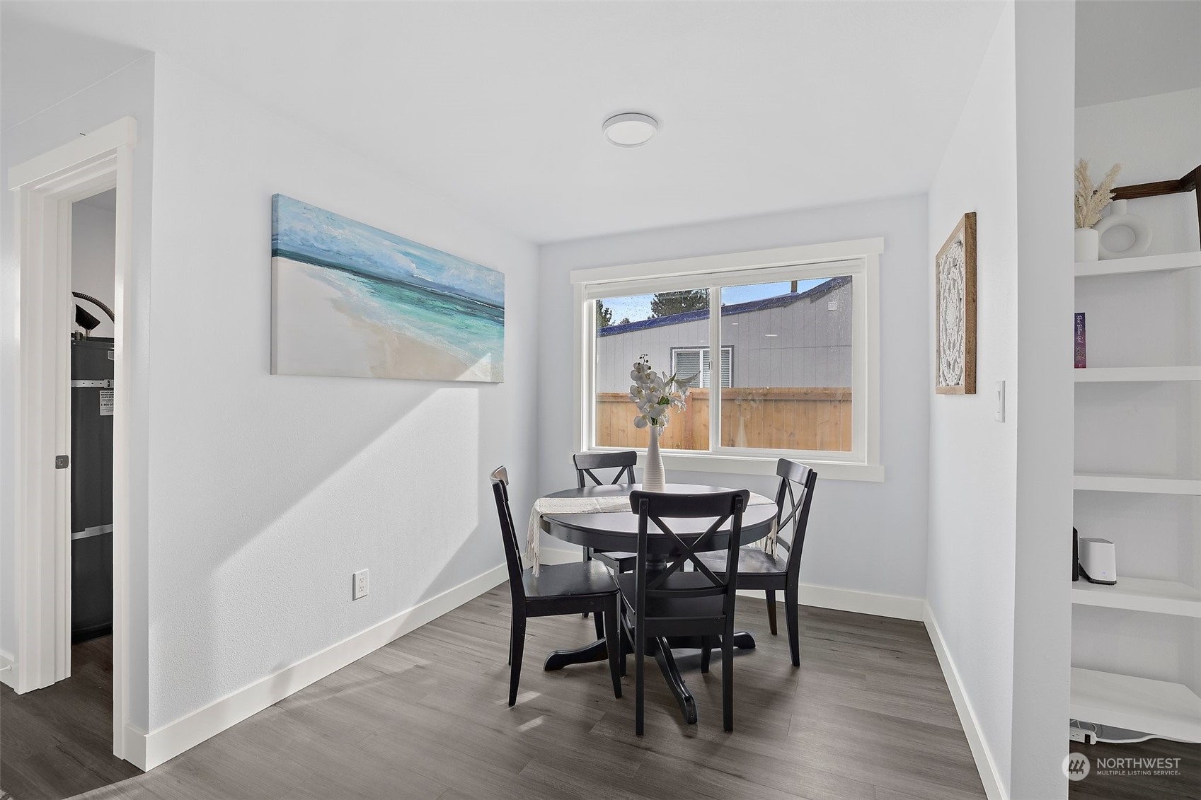 9848 18th Avenue Southwest Seattle, WA 98106 - Photo 15 of 32 a view of a dining room with furniture and wooden floor