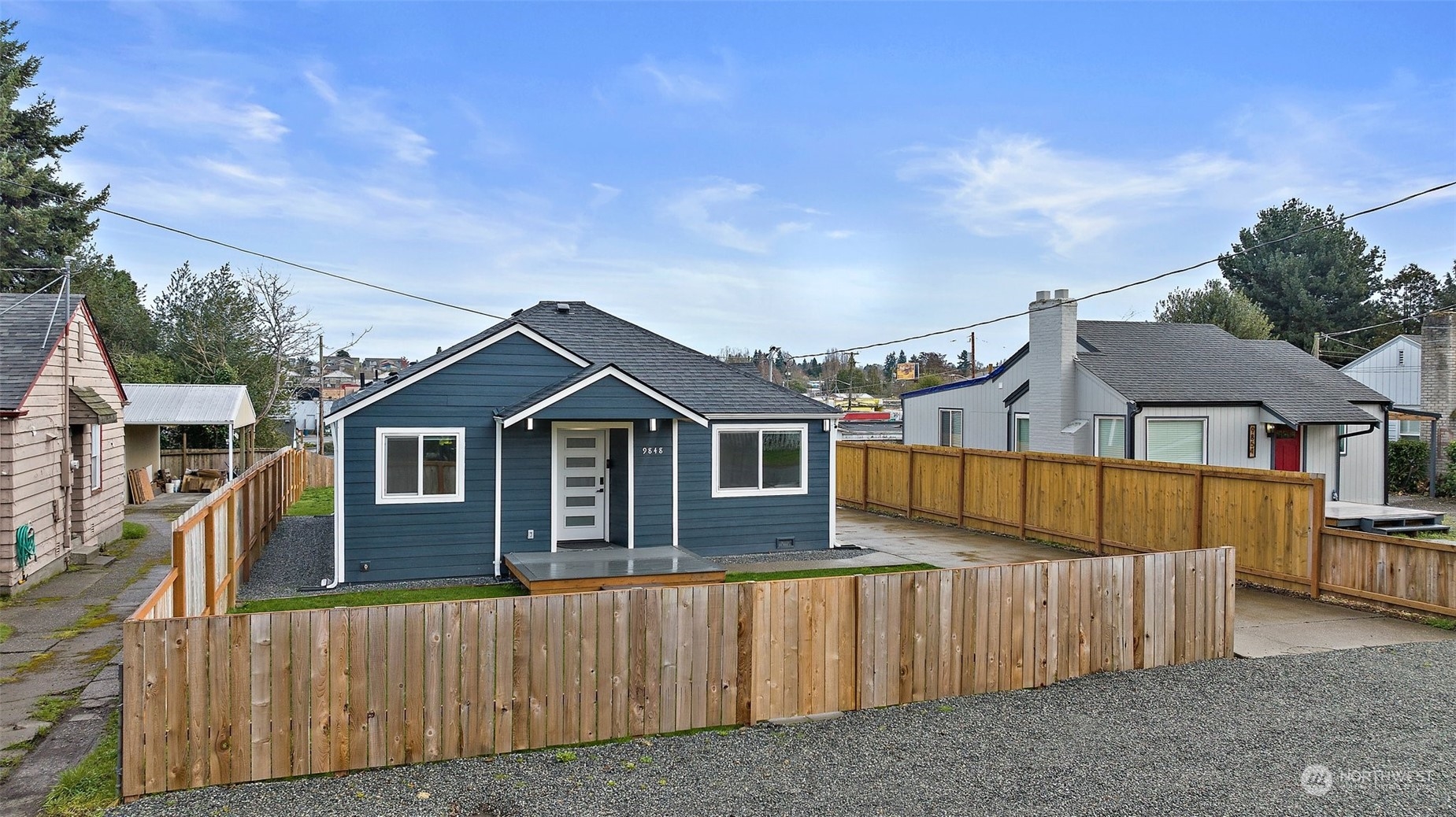 9848 18th Avenue Southwest Seattle, WA 98106 - Photo 2 of 32 a view of a house with wooden fence