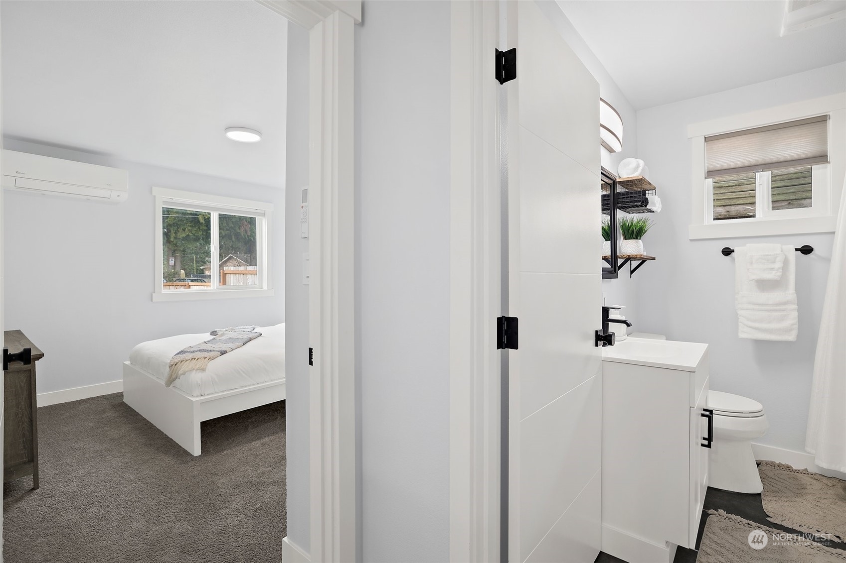 9848 18th Avenue Southwest Seattle, WA 98106 - Photo 23 of 32 a bathroom with a sink and a mirror