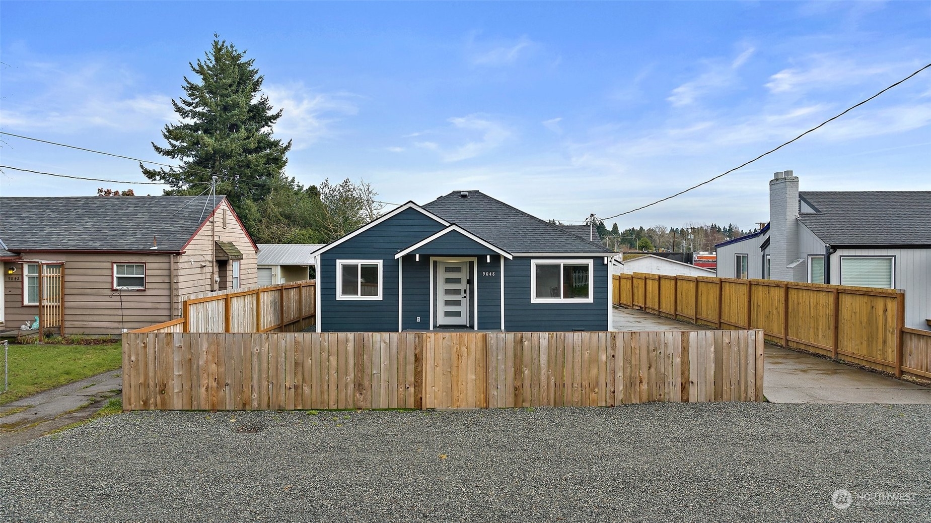 9848 18th Avenue Southwest Seattle, WA 98106 - Photo 26 of 32 front view of a house with a yard