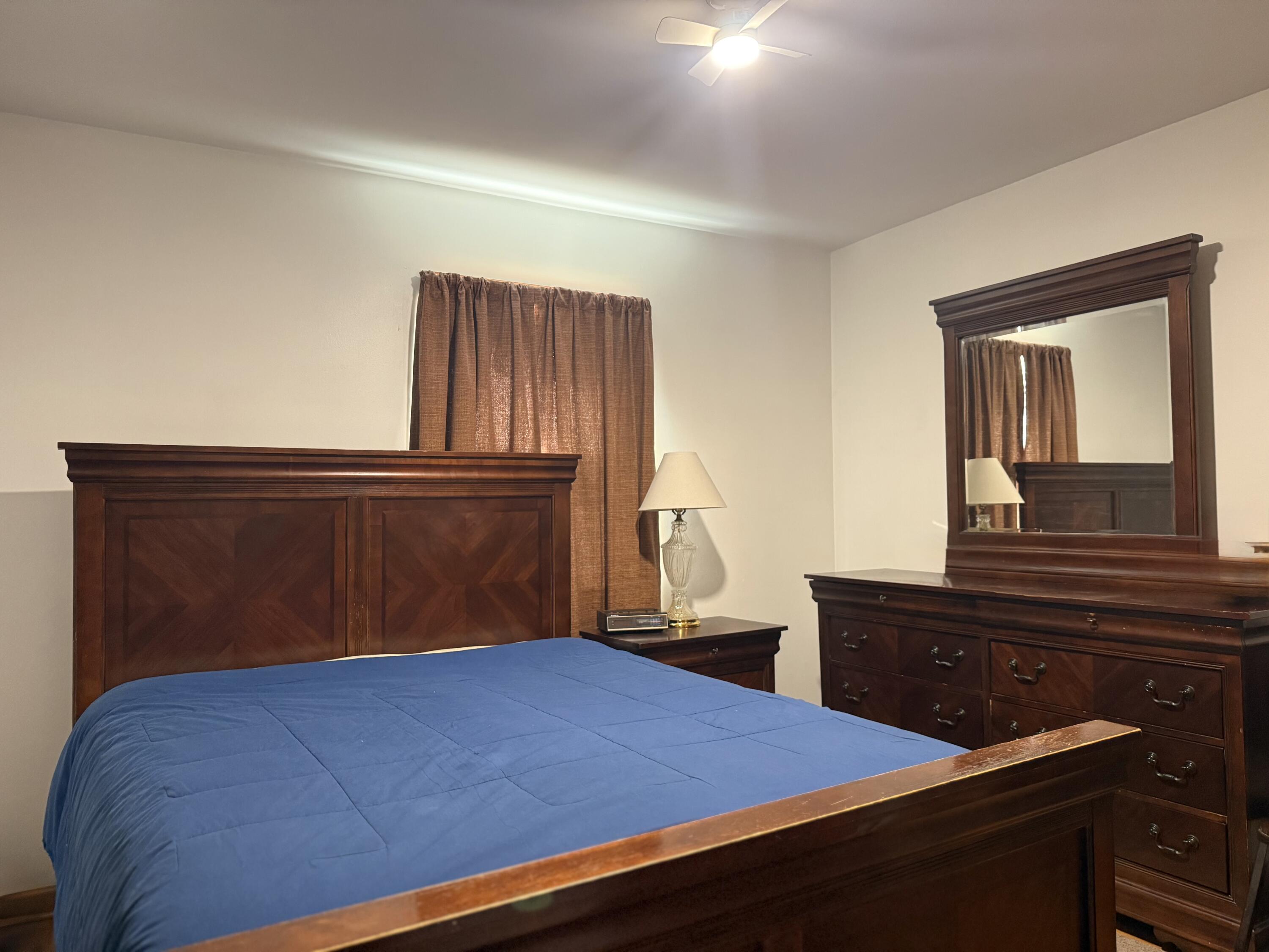 755 Goldmine Road Glade Hill, VA 24092 - Photo 8 of 13 a bedroom with a bed and dresser