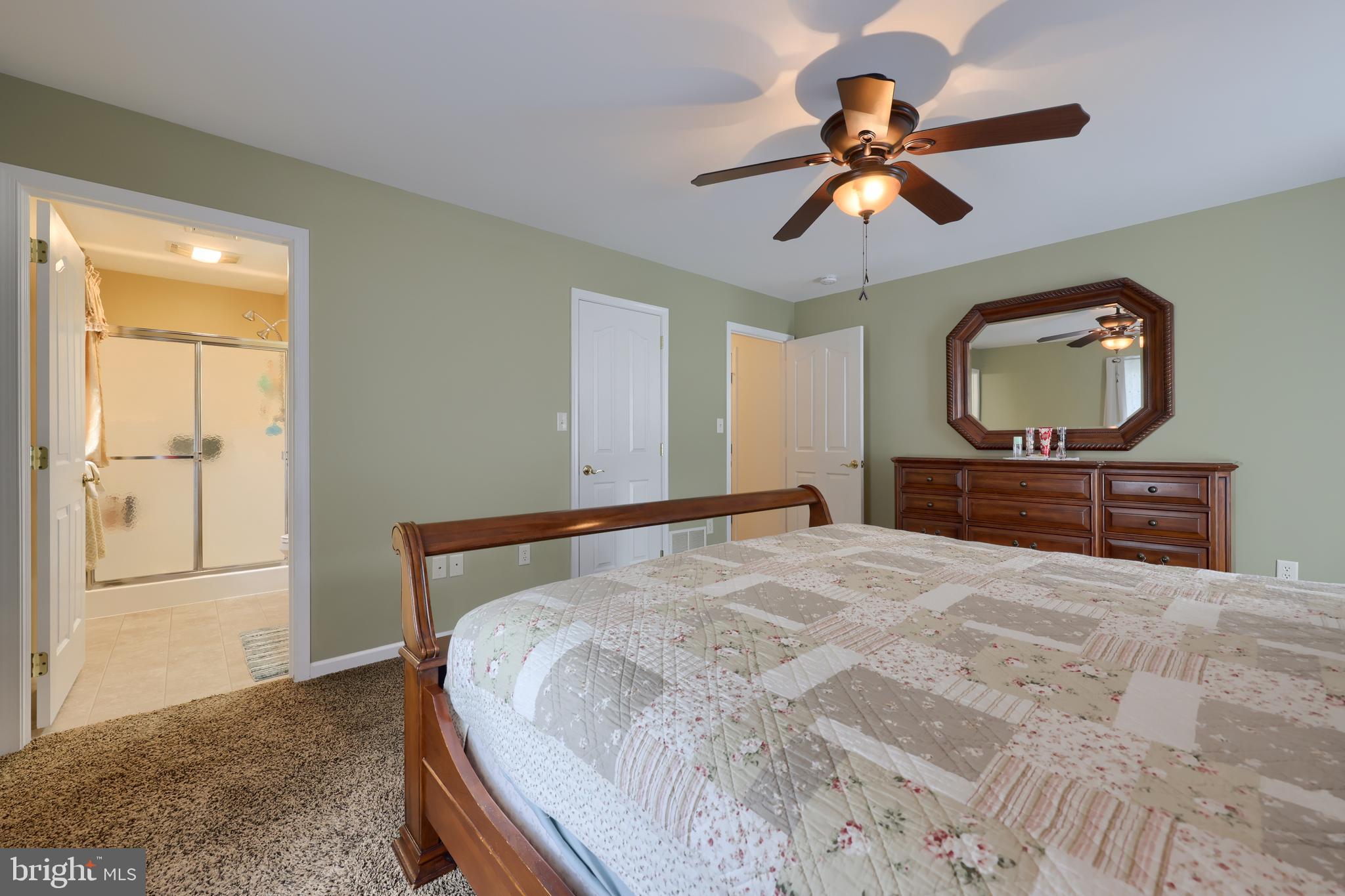737 Heather Ridge Manheim, PA 17545 - Photo 25 of 40 a bedroom with a bed and a flat screen tv