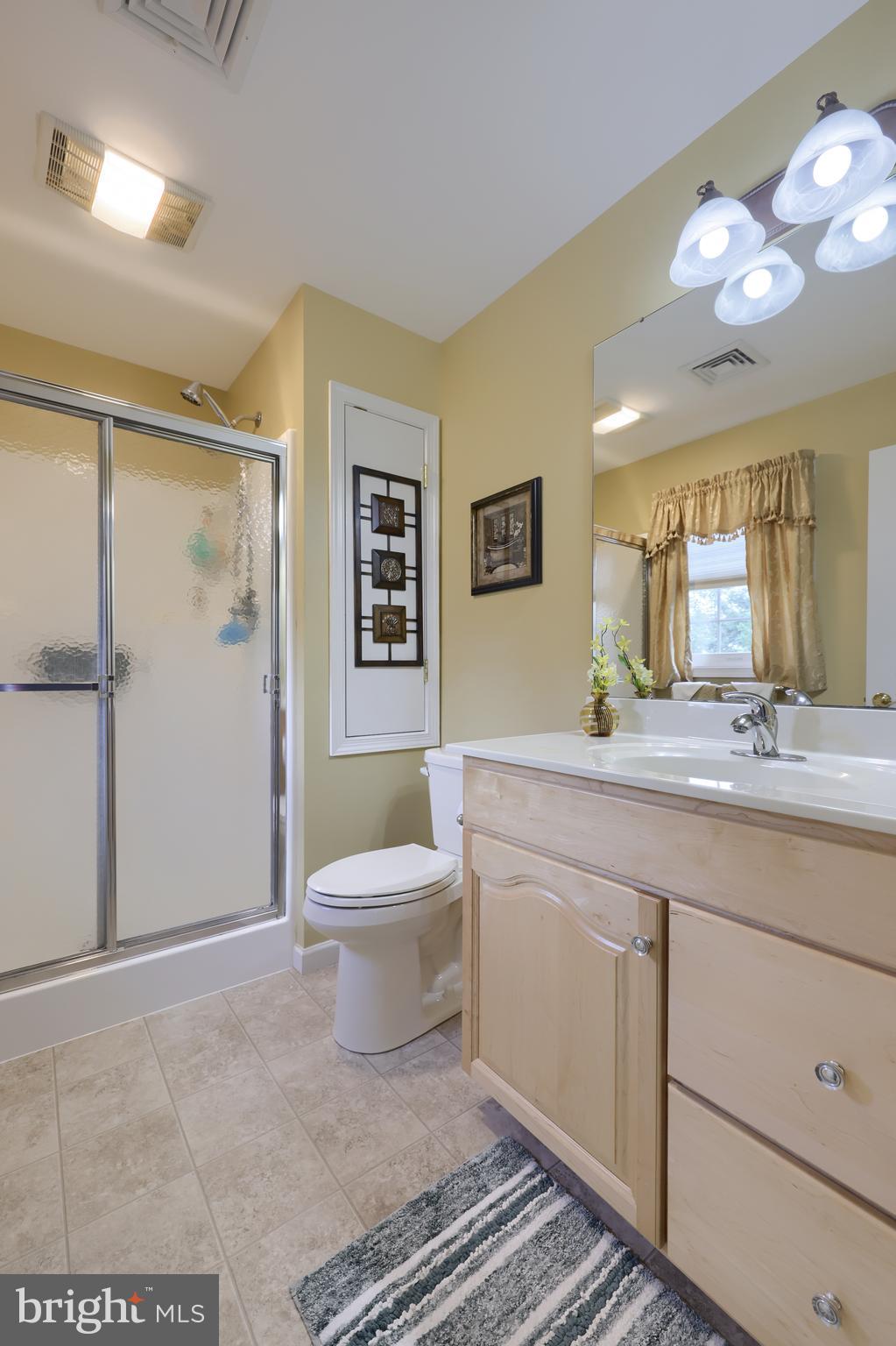 737 Heather Ridge Manheim, PA 17545 - Photo 27 of 40 a spacious bathroom with a double vanity sink a toilet and a shower