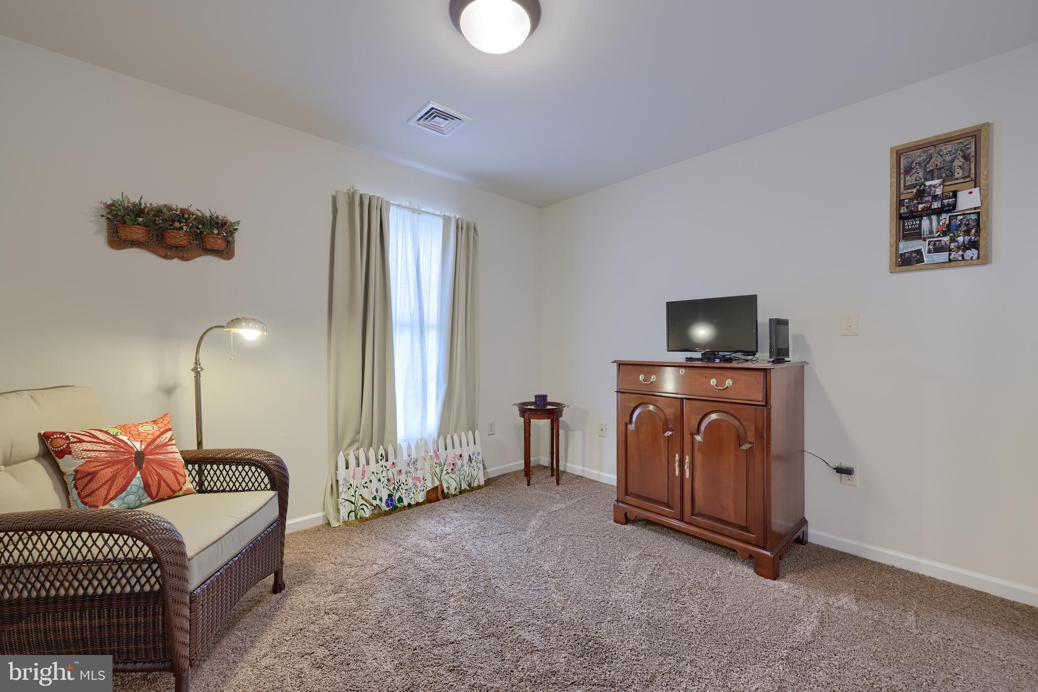 737 Heather Ridge Manheim, PA 17545 - Photo 29 of 40 a spacious bedroom with a bed and a television