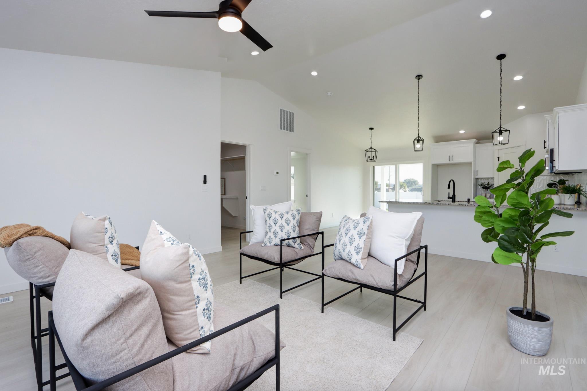 950 Campbell Street Vale, OR 97918 - Photo 12 of 37 Open-concept living space with light wood-finish flooring, vaulted ceilings, and recessed lighting