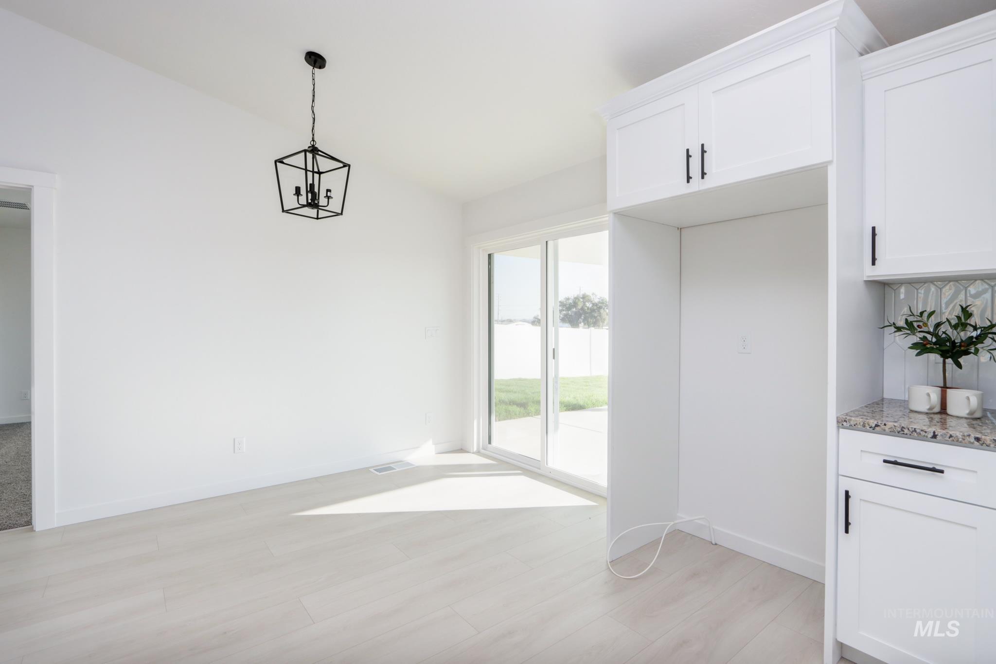 950 Campbell Street Vale, OR 97918 - Photo 15 of 37 Light wood-finish flooring with crisp white walls