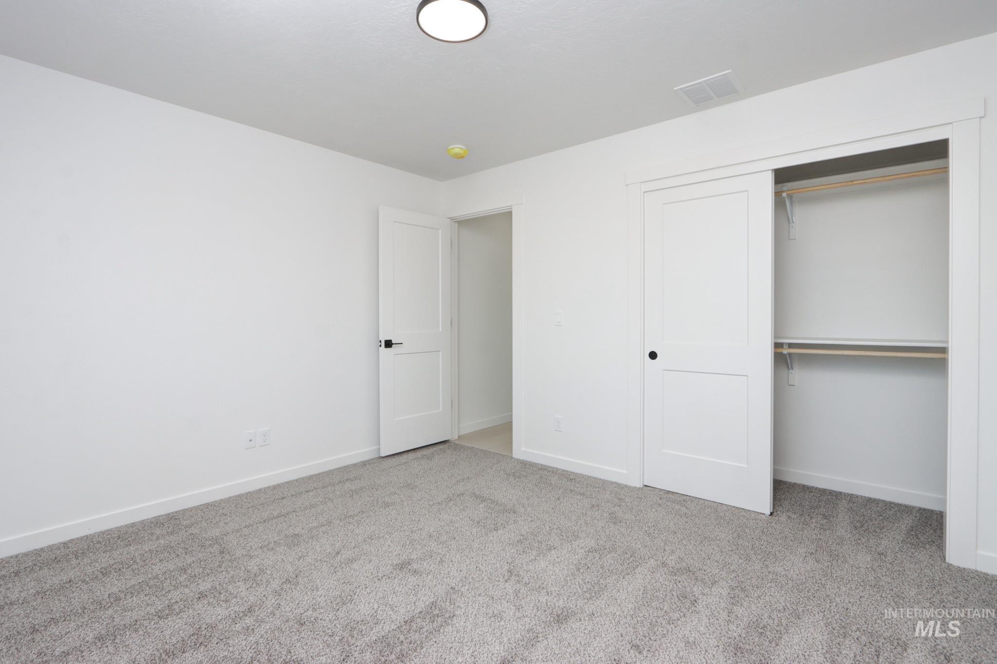 950 Campbell Street Vale, OR 97918 - Photo 29 of 37 Neutral gray carpet throughout the room