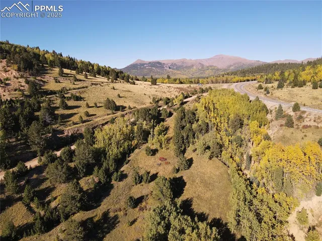 a view of a city with mountains in the background