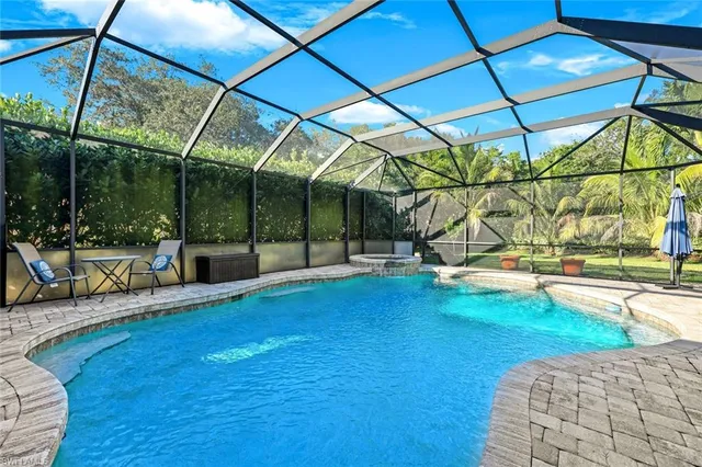 a view of a swimming pool with a patio