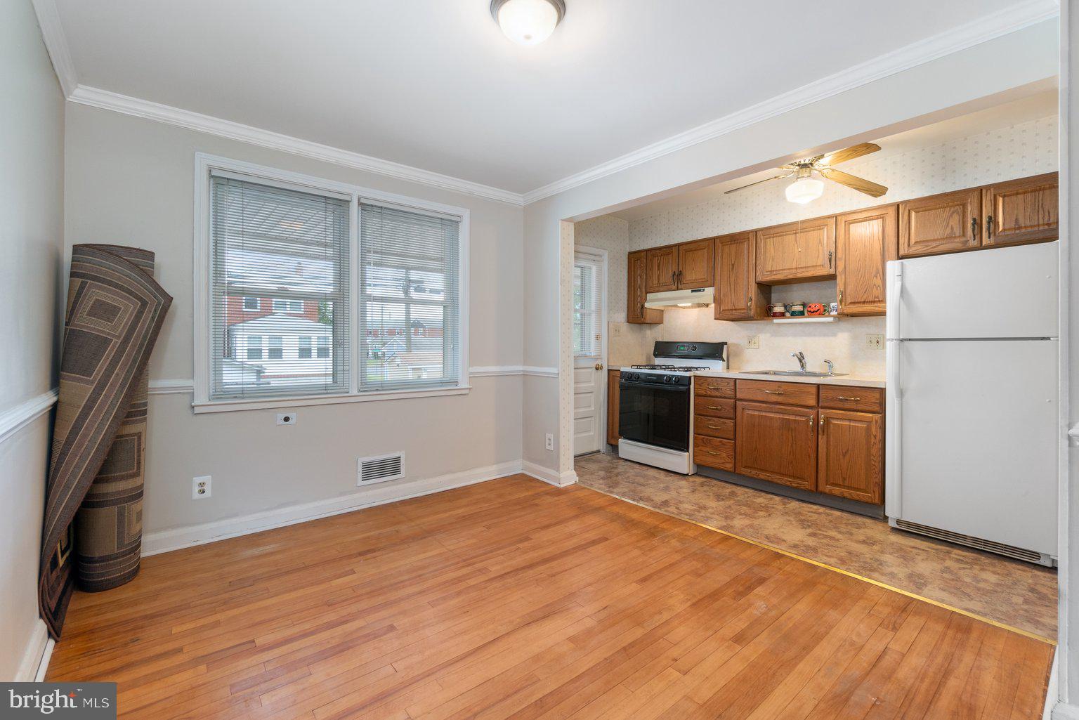 6905 Belclare Road Baltimore, MD 21222 - Photo 9 of 28 Dining Room Hardwood Floors