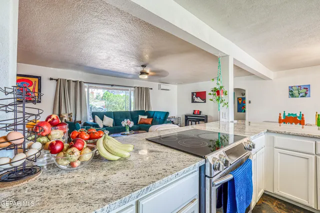 a bathroom with a toilet and a shower curtain
