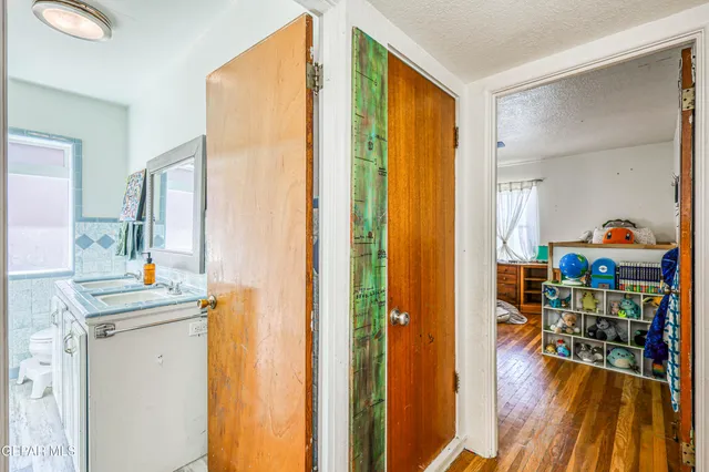 a view of workspace with wooden floor windows