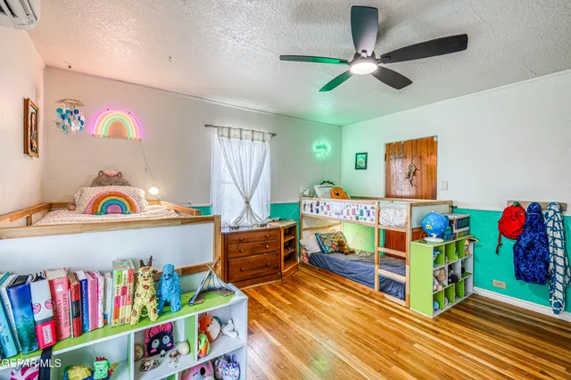 a view of a swimming pool with a bench in front of building