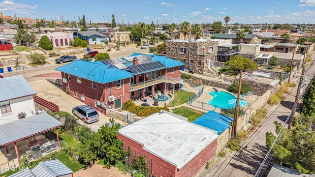 a living room with furniture a rug and a floor to ceiling window