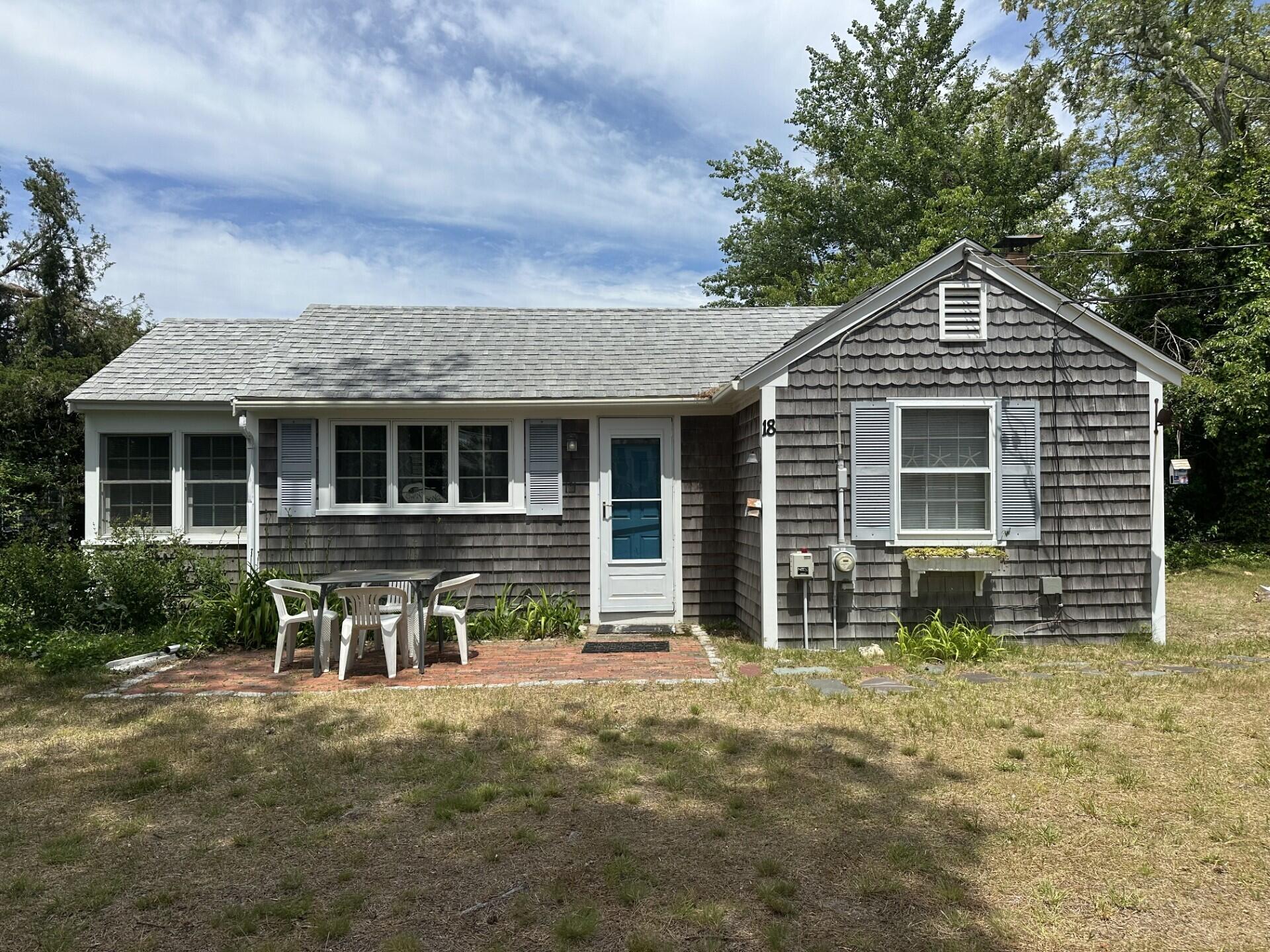 18 Myrtle Lane Dennis Port, MA 02639 - Photo 2 of 25 a front view of a house with garden
